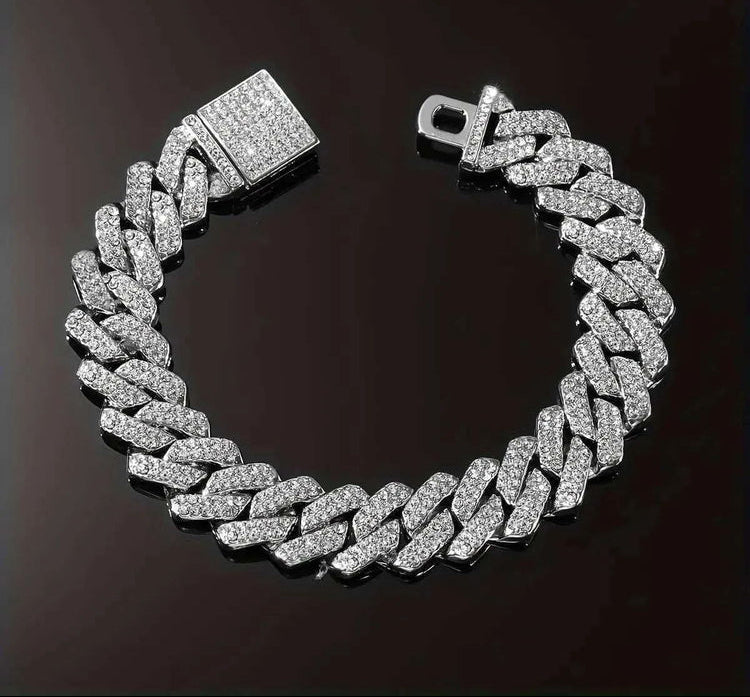 Silver chain bracelet with clear stones on a dark background