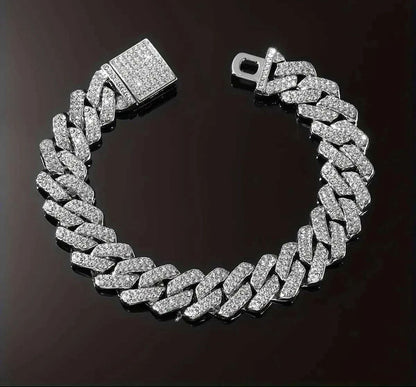 Silver chain bracelet with clear stones on a dark background